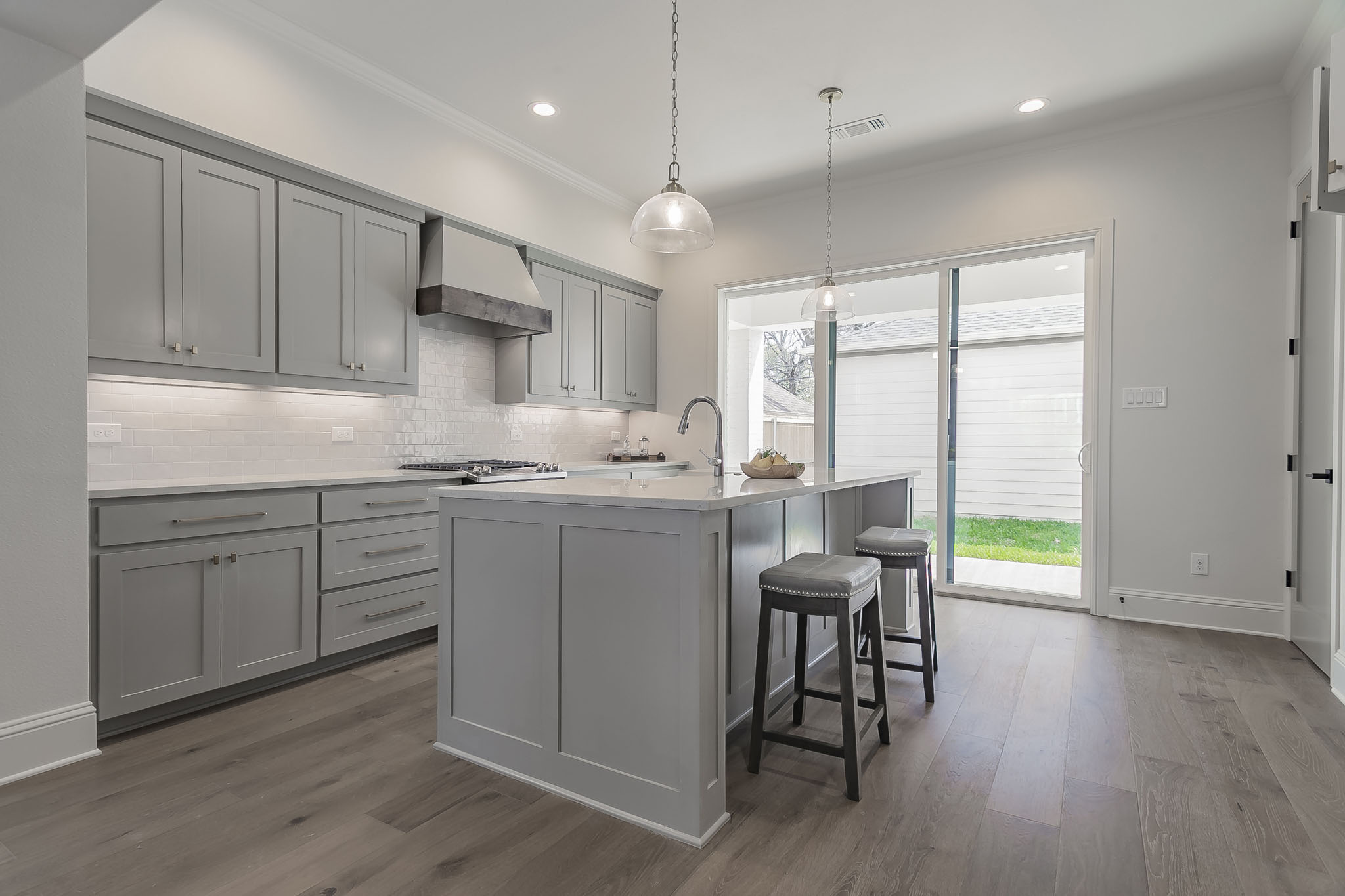 Townhome Kitchen Grey Cabinets Wood Hood