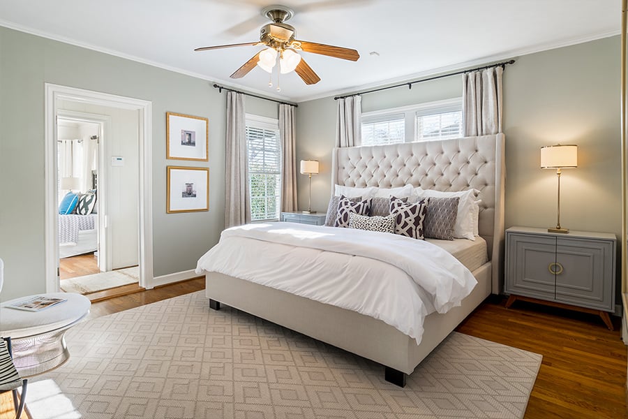 Bedroom Custom Home Design: Tufted Master Bed With Ceiling Fan and Oak Floors