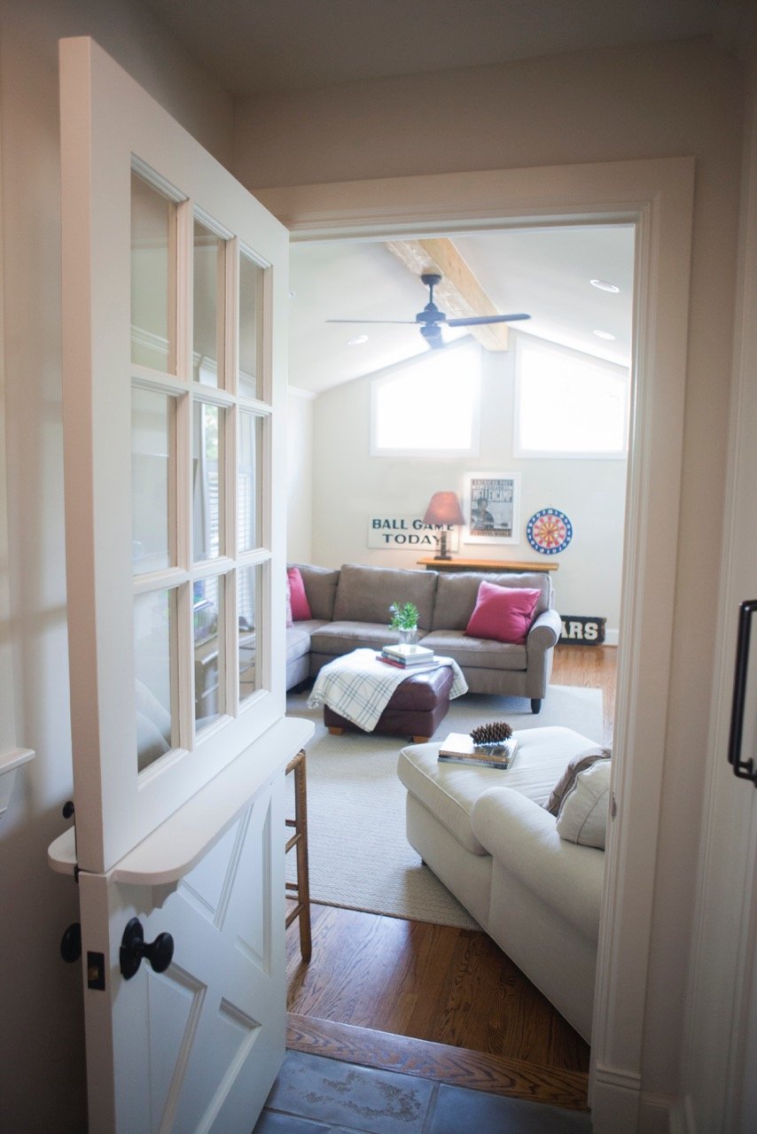 Living Room Design (Texas Homes): game room with dutch door and vaulted ceiling