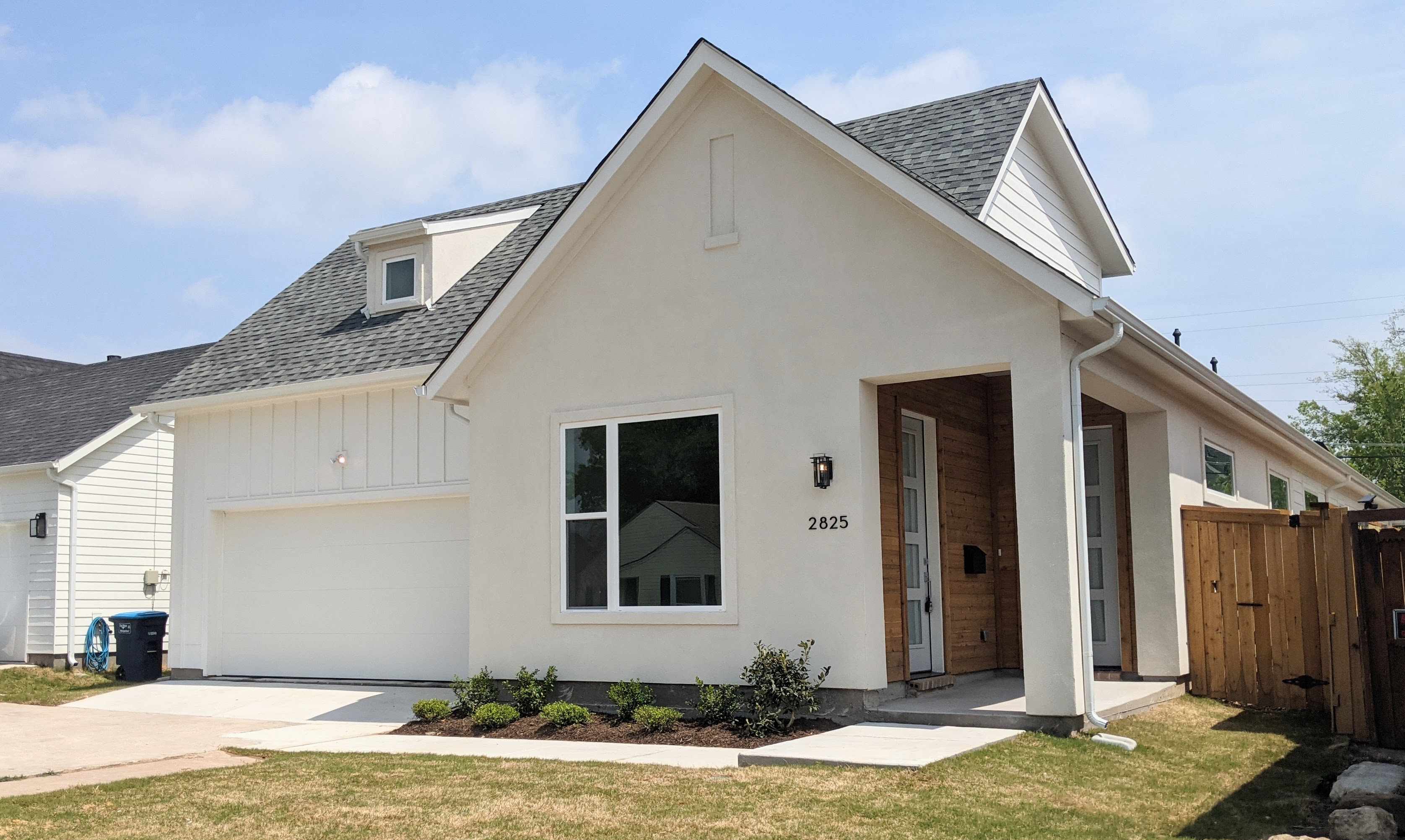 Stucco infill home with stained front porch