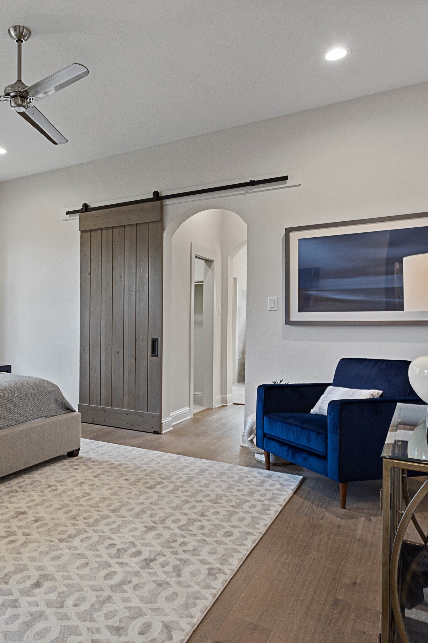 Primary with barn door blue chair